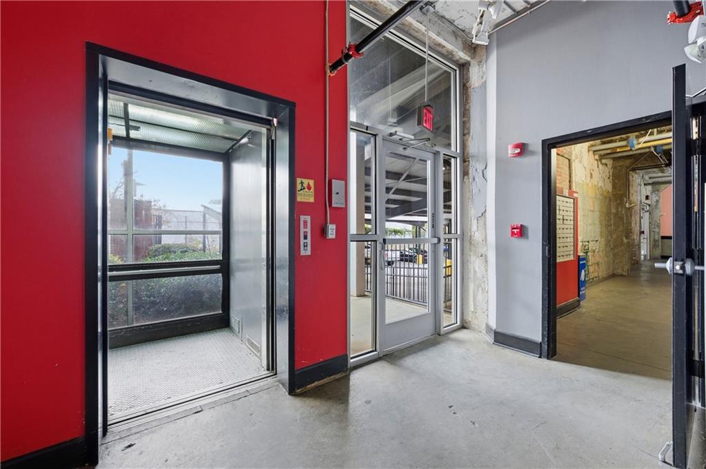 505 Whitehall Street Southwest, Unit 101 Atlanta, GA 30303 - Photo 19 of 31 a view of a hallway with closet and furniture