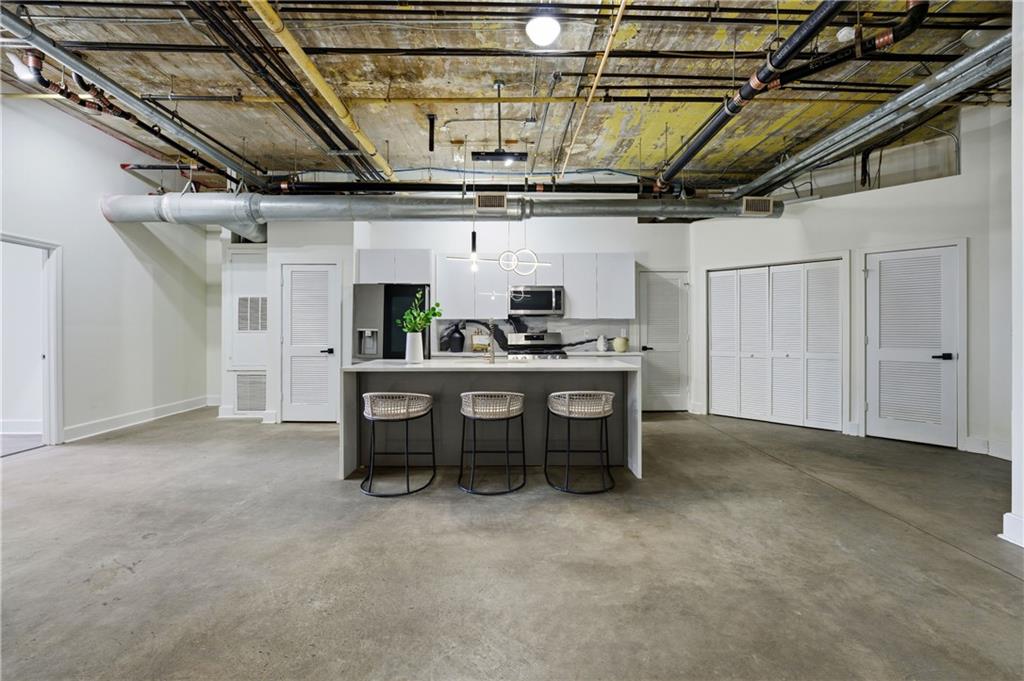 505 Whitehall Street Southwest, Unit 101 Atlanta, GA 30303 - Photo 5 of 31 a view of a room with chairs