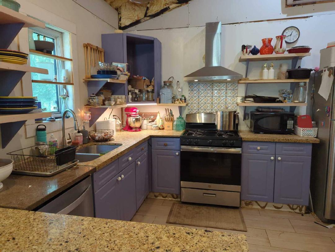 600 Jasper Floyd Road Ponce de Leon, FL 32455 - Photo 7 of 27 a kitchen with stainless steel appliances granite countertop a stove and cabinets