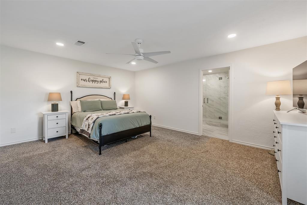 300 Rash Lane Terrell, TX 75160 - Photo 12 of 28 a bedroom with a bed and a night stand