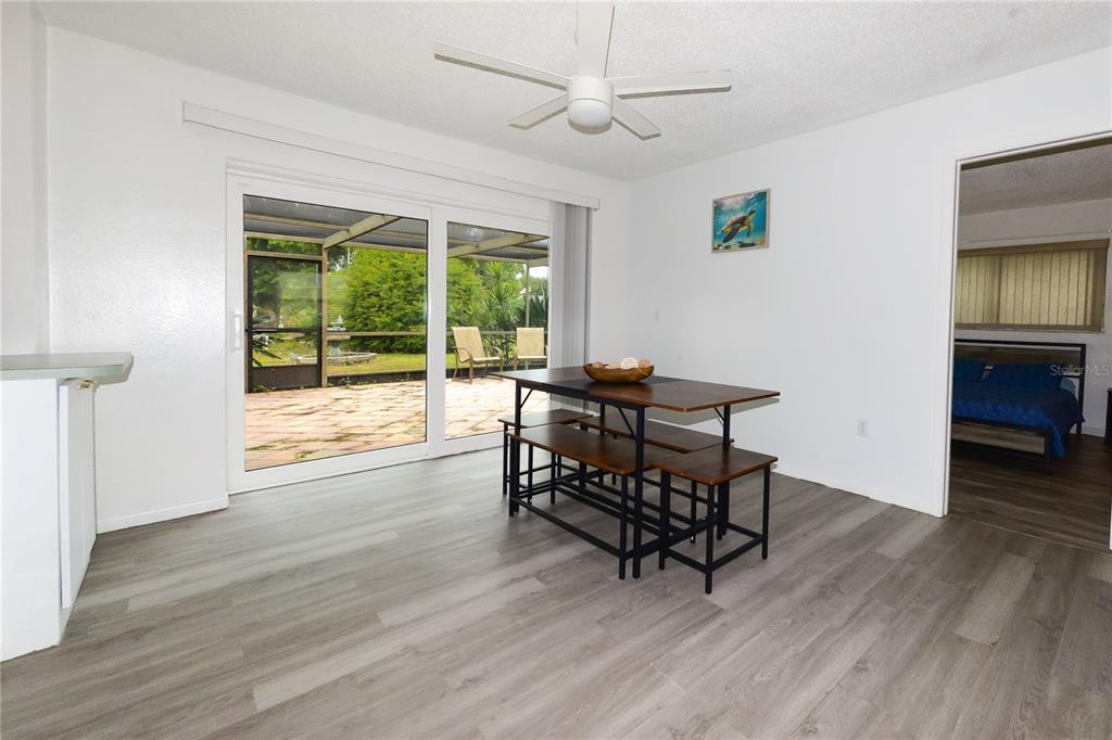 124 Caddy Road Rotonda West, FL 33947 - Photo 11 of 41 a view of a workspace with wooden floor and a window