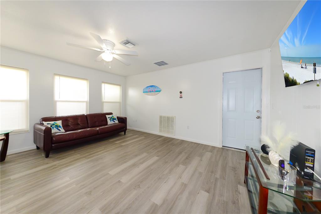 124 Caddy Road Rotonda West, FL 33947 - Photo 20 of 41 a living room with furniture and a wooden floor