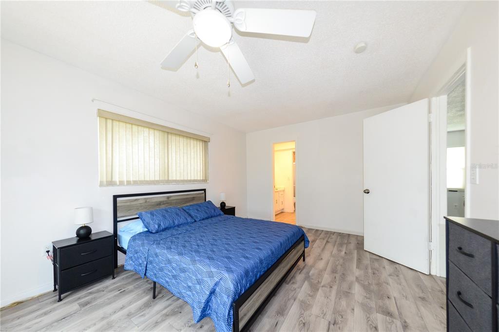 124 Caddy Road Rotonda West, FL 33947 - Photo 21 of 41 a bedroom with a bed and window