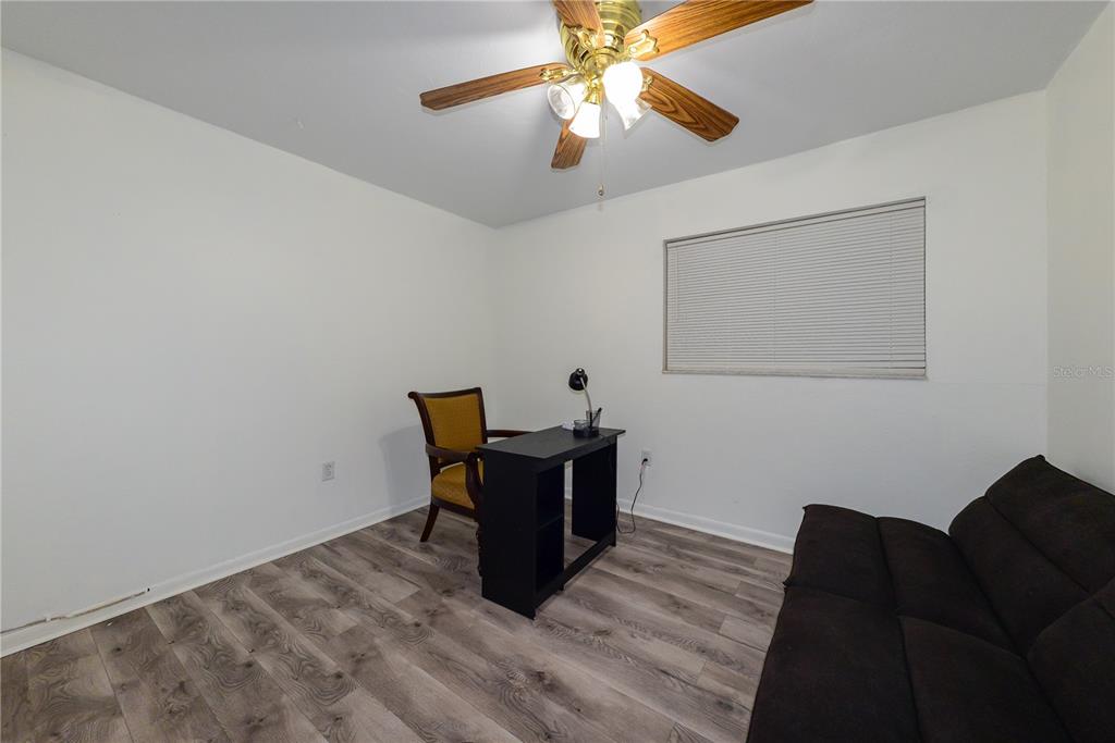 124 Caddy Road Rotonda West, FL 33947 - Photo 29 of 41 a living room with furniture