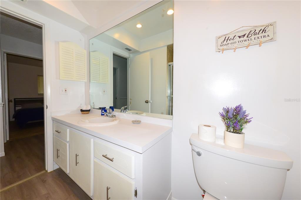 124 Caddy Road Rotonda West, FL 33947 - Photo 31 of 41 a bathroom with a sink and a mirror