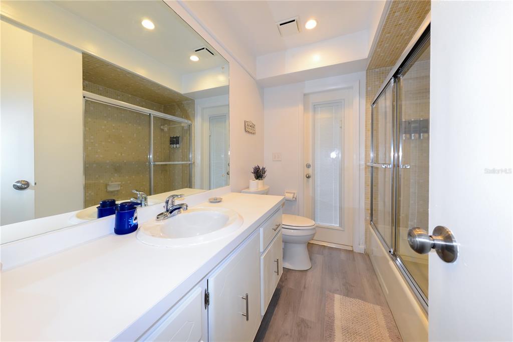 124 Caddy Road Rotonda West, FL 33947 - Photo 34 of 41 a bathroom with a double vanity sink mirror and toilet