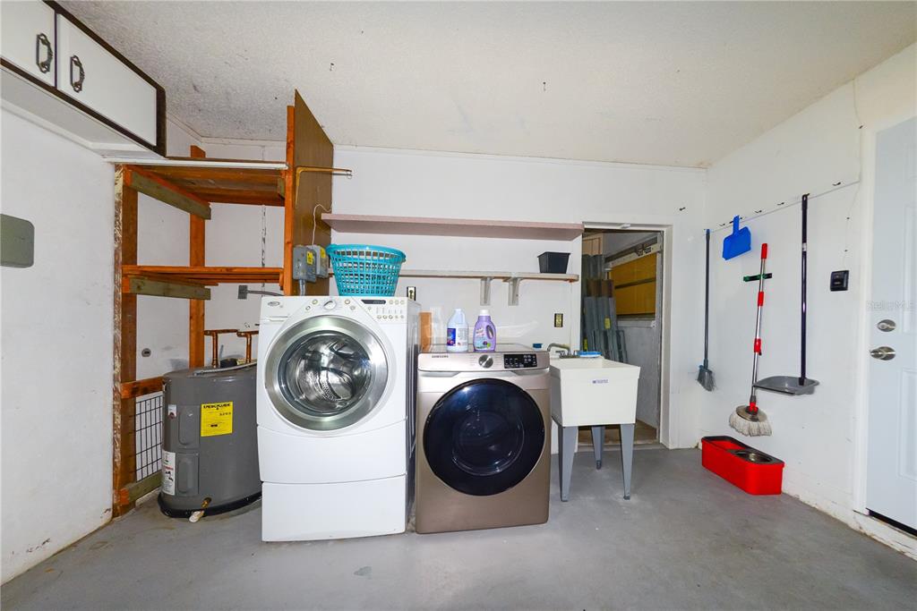 124 Caddy Road Rotonda West, FL 33947 - Photo 38 of 41 a utility room with dryer and washer