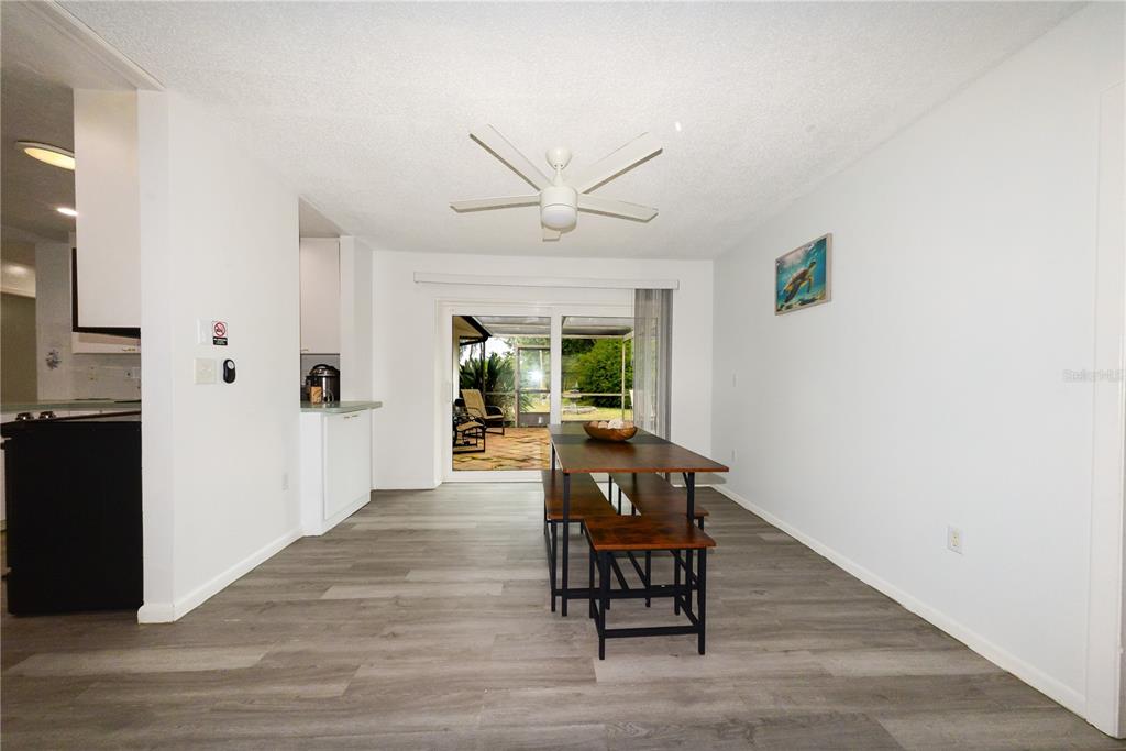 124 Caddy Road Rotonda West, FL 33947 - Photo 8 of 41 a view of a livingroom with furniture and a ceiling fan