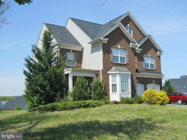 3602 Lions Field Road Triangle, VA 22172 - Photo 2 of 22 a front view of a house with a yard