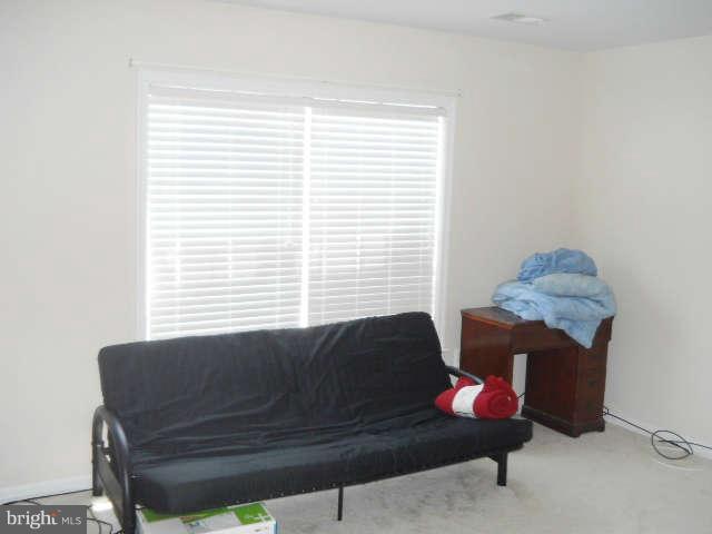 3602 Lions Field Road Triangle, VA 22172 - Photo 19 of 22 a living room with furniture and a window