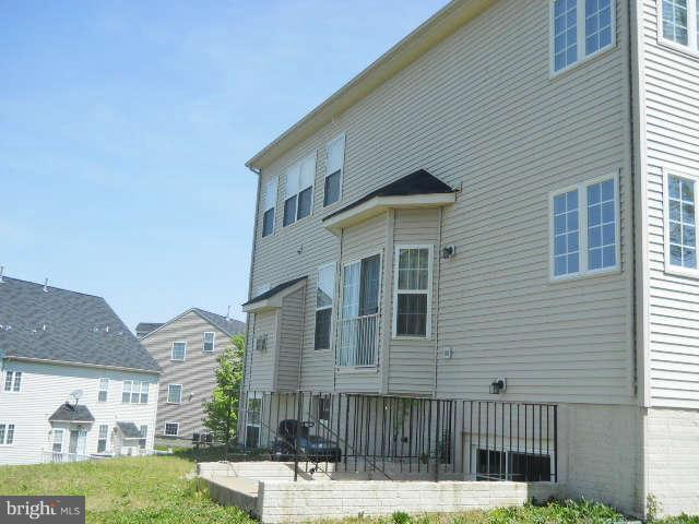 3602 Lions Field Road Triangle, VA 22172 - Photo 22 of 22 a front view of a house with a yard