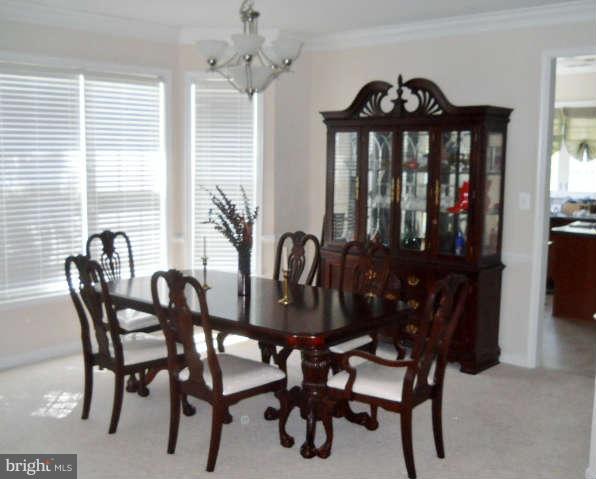 3602 Lions Field Road Triangle, VA 22172 - Photo 4 of 22 a view of a dining room with furniture and window