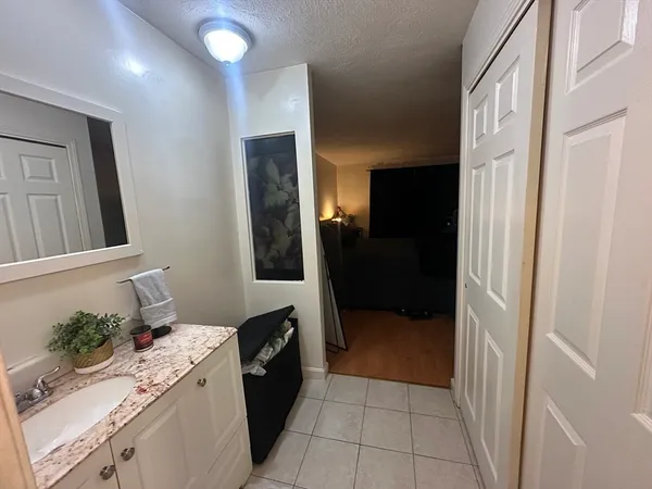 a kitchen with a refrigerator and a stove