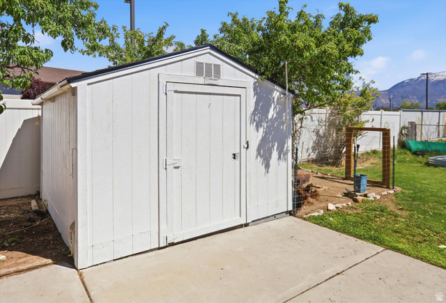 5108 South 2000th Street West Roy, UT 84067 - Photo 50 of 61 View of shed featuring a fenced backyard and a mountain view