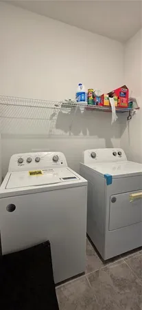 a utility room with washer and dryer