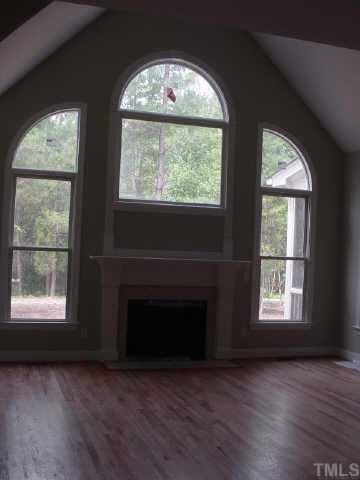 7224 Spring Meadow Lane Raleigh, NC 27606 - Photo 3 of 10 View of Family Room from foyer. Soaring ceilings & windows.