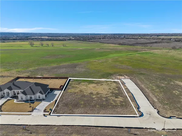 a view of a swimming pool with a yard