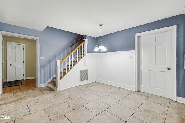 a view of entryway with stairs and wooden floor