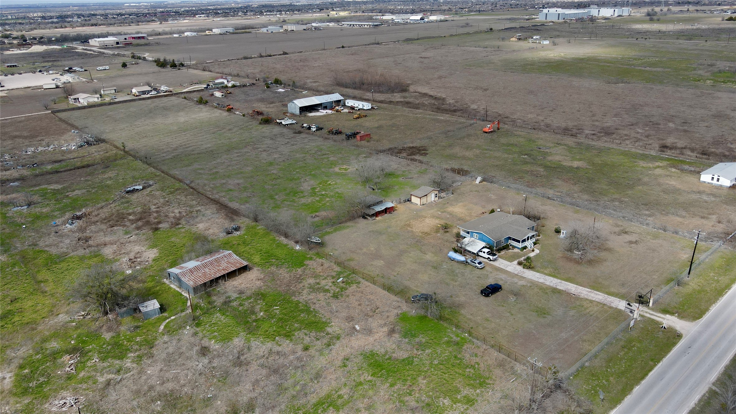 12322 Old Kimbro Road Manor, TX 78653 - Photo 13 of 18 an aerial view of a house with a yard