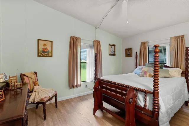 a bedroom with a bed and a table in it