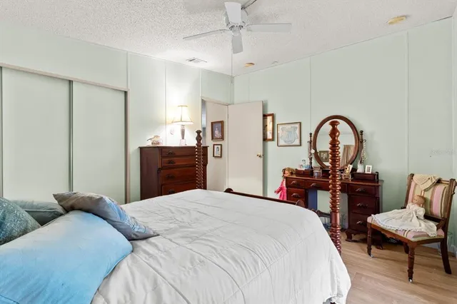 a bedroom with a bed and a dresser