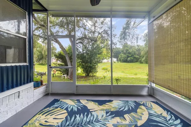 a view of a room and wooden floor