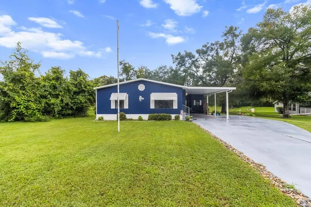 a view of a house with a big yard
