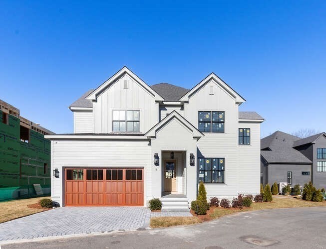 8 Common Court Lexington, MA 02421 - Photo 2 of 18 a front view of a house with a yard
