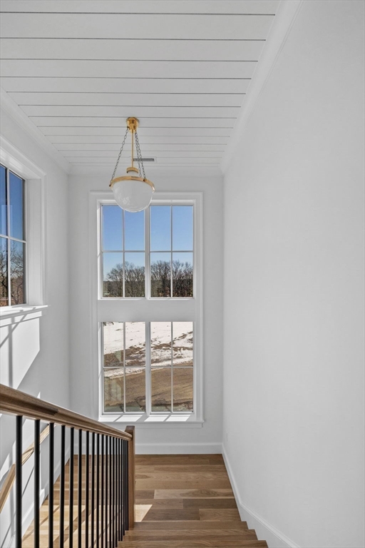 8 Common Court Lexington, MA 02421 - Photo 9 of 18 a view of a room with wooden floor and windows