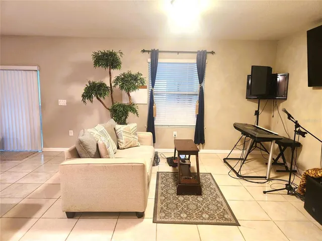 a view of a dining room with furniture and a window