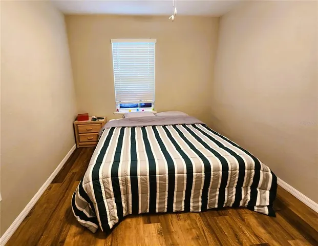 a room with a bed and a window