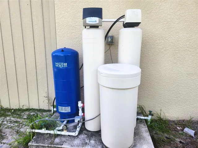 a backyard of a house with lots of green space and garden