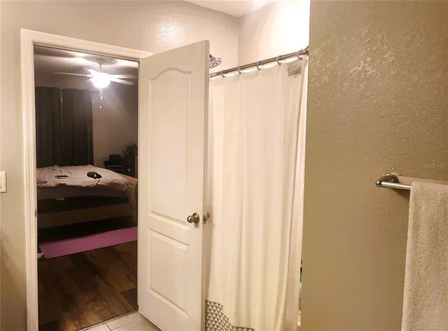 a kitchen with stainless steel appliances granite countertop a sink refrigerator and cabinets