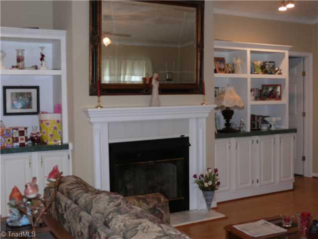 4283 Waynick Meadow Road Asheboro, NC 27205 - Photo 2 of 11 Living Room. Living room has beautiful gas log fireplace and laminate floors