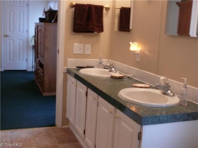 4283 Waynick Meadow Road Asheboro, NC 27205 - Photo 3 of 11 Master Bath/Spa. Master bath has nice updated quality flooring and double sinks