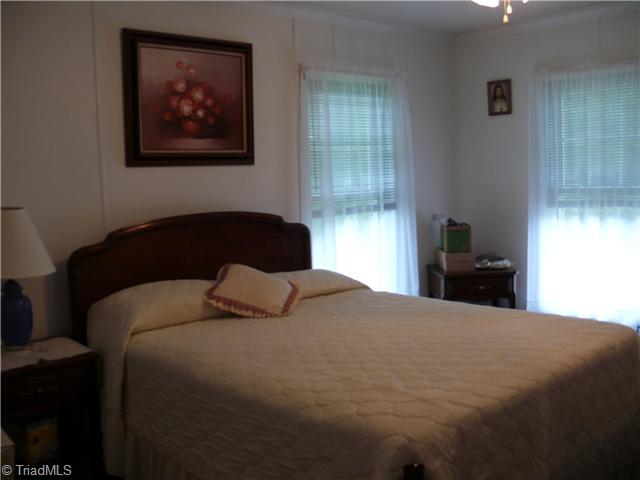 4283 Waynick Meadow Road Asheboro, NC 27205 - Photo 6 of 11 2nd Bedroom. Second bedroom has carpet and ceiling fan