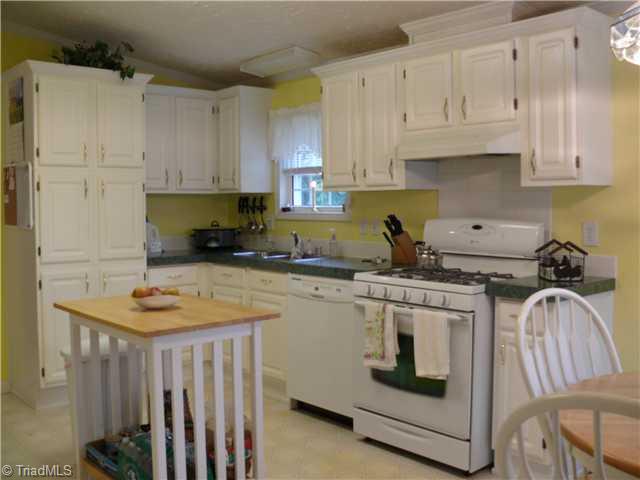 4283 Waynick Meadow Road Asheboro, NC 27205 - Photo 7 of 11 Kitchen. Nice kitchen with dishwasher only apx 1 year old and nice 5 burner gas range, electric hookup there if buyer preferred to change to electric range