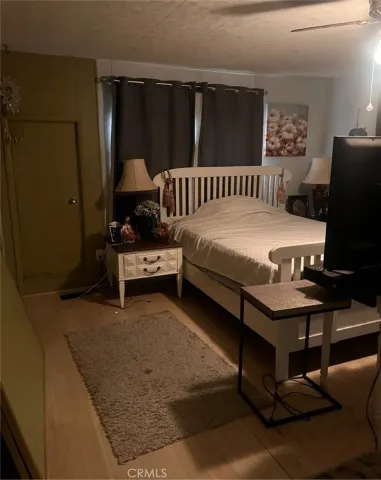 a bedroom with furniture and a window