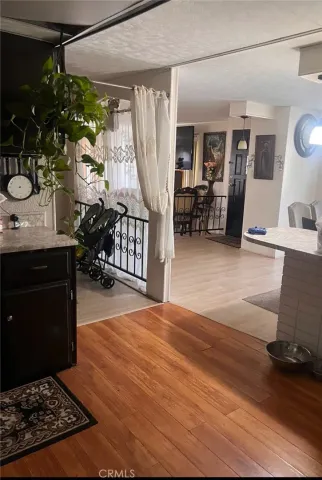 a room with wooden floor and furniture