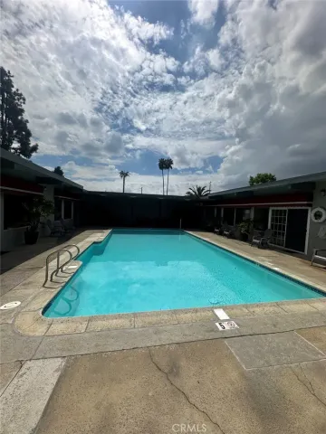a view of a backyard with sitting area