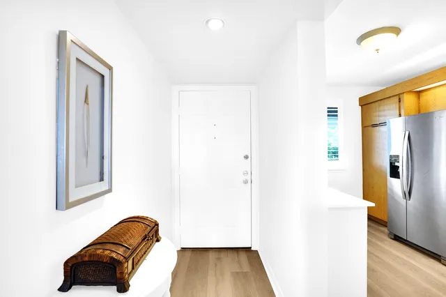 a view of hallway with livingroom and furniture