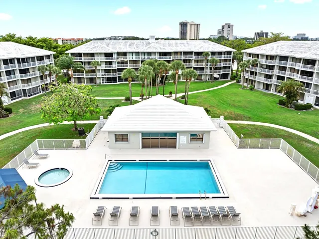 a view of yard with swimming pool and outdoor seating