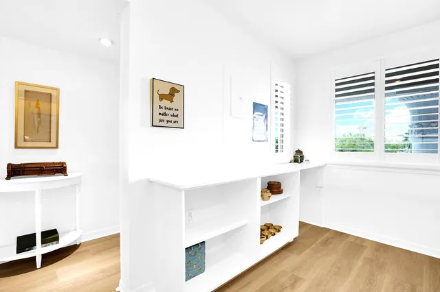 a view of cabinets and wooden floor