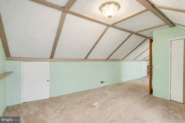 a view of room with window and hardwood