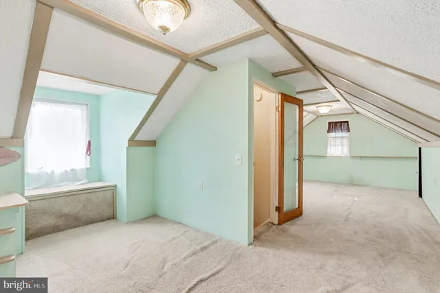 a view of a swimming pool with a patio and a yard