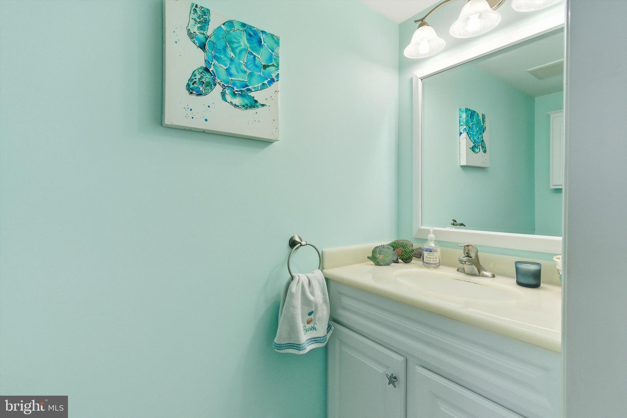 2 West Janet Road, Unit 1 Long Beach Township, NJ 08008 - Photo 15 of 36 a bathroom with a sink and a mirror