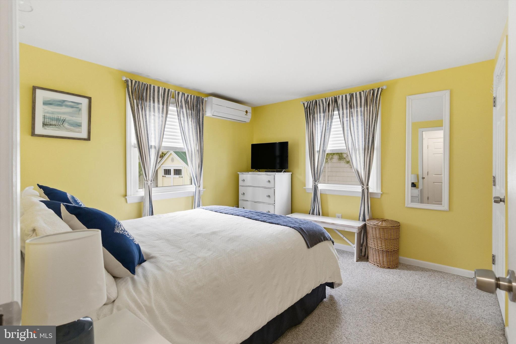 2 West Janet Road, Unit 1 Long Beach Township, NJ 08008 - Photo 16 of 36 a bedroom with a bed and wooden floor