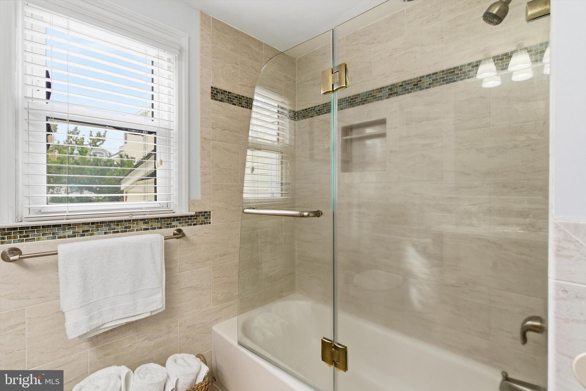 2 West Janet Road, Unit 1 Long Beach Township, NJ 08008 - Photo 18 of 36 a bathroom with a shower
