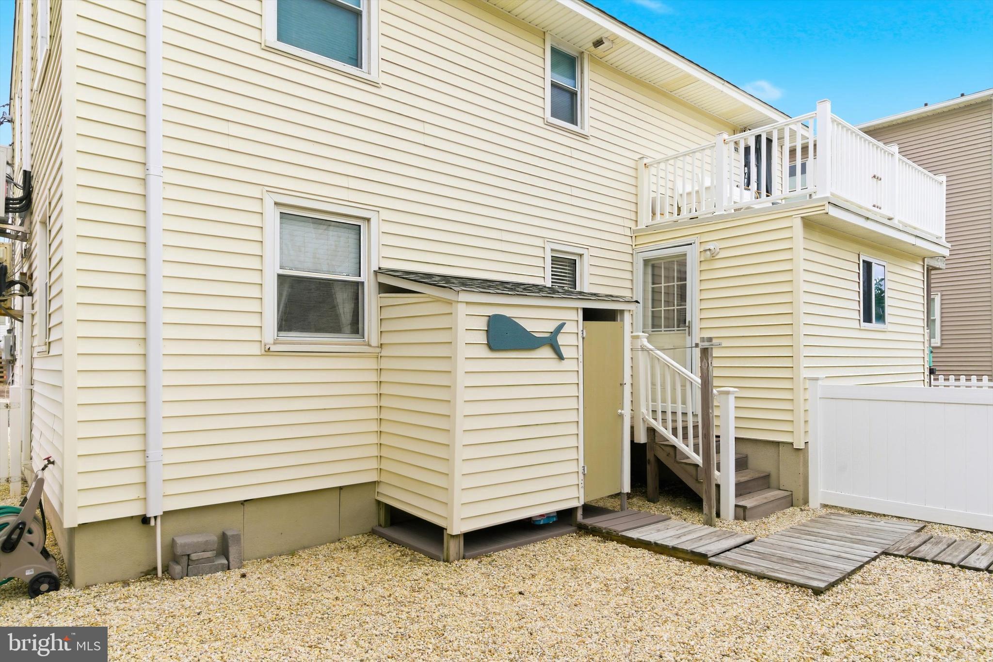 2 West Janet Road, Unit 1 Long Beach Township, NJ 08008 - Photo 22 of 36 a view of a white house with a small space