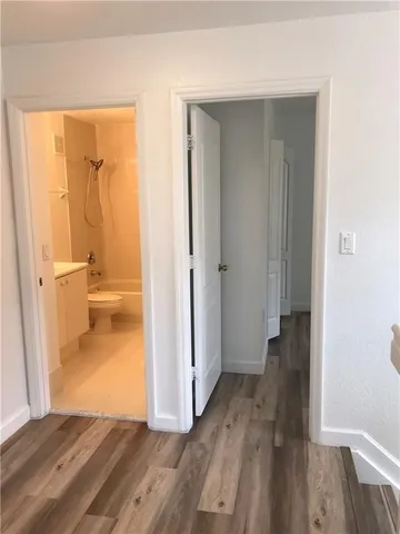 a view of a bathroom from a hallway